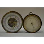 A Victorian aneroid barometer in brass drum case, 12 cm diameter,