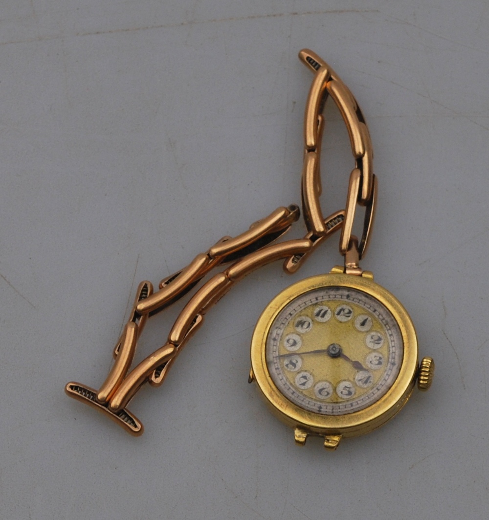 A lady's 18ct gold Movado wristwatch with silvered and gilt dial and 15-jewel movement, London 1920,