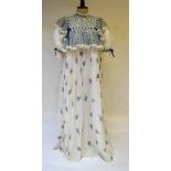 A 1970's Gina Fratini evening dress, ivory white cotton voile with high lace neck inter-woven with