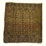 An antique Turkoman rug, last quarter 19th century having three rows of geometric guls on red-
