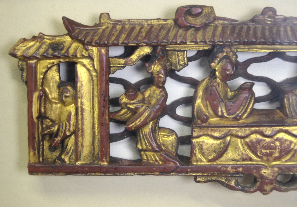 A Chinese red and gilt lacquered wood carving of two seated figures with attendants within a - Image 4 of 5