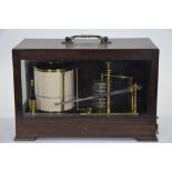 An unbranded oak cased lacquered brass barograph,
