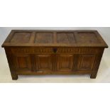 A late 17th / 18th century carved panelled oak coffer,