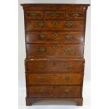 An 18th century feather-banded walnut chest on chest having three short over six long graduated