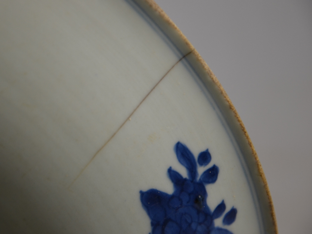 A Chinese 17th century blue and white dish decorated with a central flower head surrounded by - Image 5 of 13