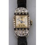 An Art Deco diamond onyx set cocktail watch white metal set in oval case with square dial and