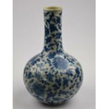 A Chinese blue and white bottle vase decorated with flowers and foliage, Yongzhing seal mark but