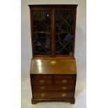 A late 18th/early 19th century mahogany astragal glazed bureau bookcase having a fitted interior