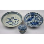 A Chinese small circular box and cover, 4 cm dia., and a blue and white saucer decorated with a