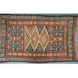 An old Sumak rug, the worn geometric design on red ground Condition Report overall wear, loss and