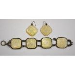 A Chinese mother of pearl bracelet and pair of matching earrings carved with peony to/w a Siamese