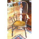 A 19th century yew-wood and elm beech high back Windsor pad-arm chair, Nottinghamshire circa 1840,