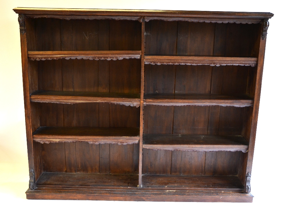 A Victorian oak library open bookcase, divided into two rows of three adjustable shelves,