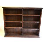 A Victorian oak library open bookcase, divided into two rows of three adjustable shelves,