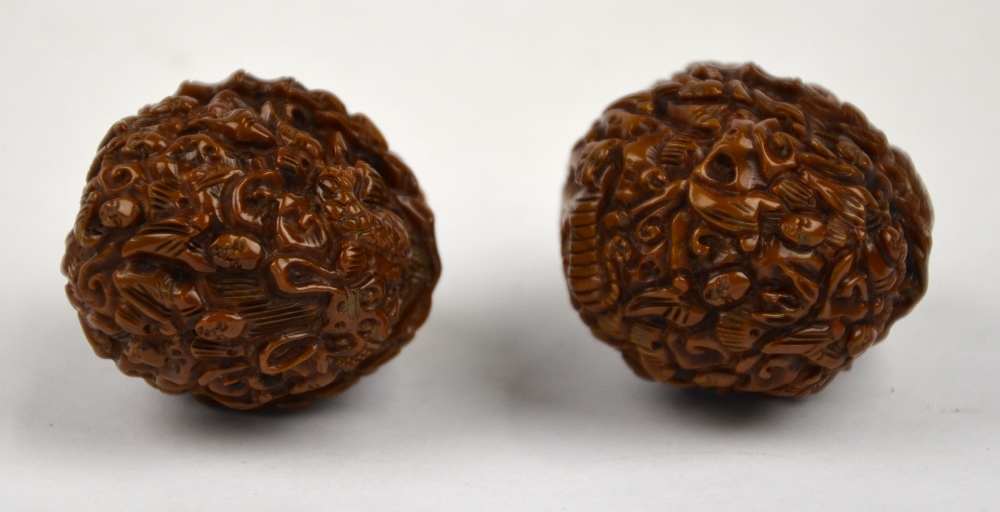 Two Chinese walnuts profusely carved with figures (2) - Image 4 of 5