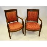 A pair of 19th century continental fruitwood framed open armchair having later upholstered back