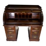 A good Victorian mahogany pedestal cylinder bureau having a well fitted interior of drawers and