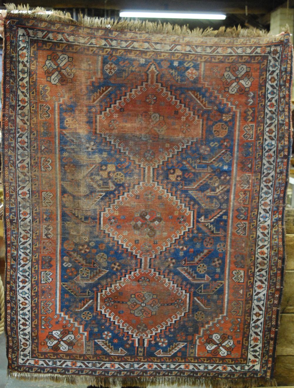 An antique Persian Shiraz rug, blue/red ground, 1.62 x 1.20 m Condition Report Overall wear, loss to