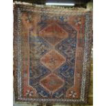 An antique Persian Shiraz rug, blue/red ground, 1.62 x 1.20 m Condition Report Overall wear, loss to