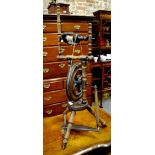 An antique cottage turned fruitwood spinning wheel,