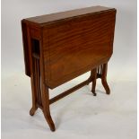 A Victorian ebony line inlaid satinwood Sutherland table having canted corner drop leaves raised on