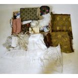 A box and a shallow wicker layette tray containing assorted textiles, wool tapestries,