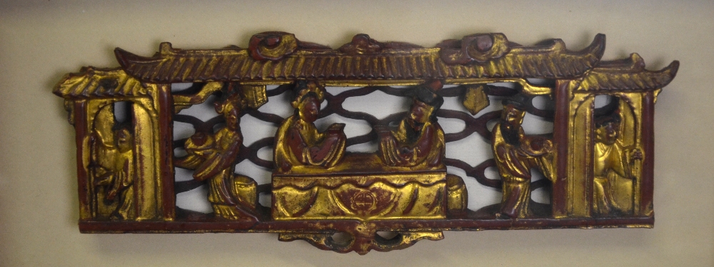 A Chinese red and gilt lacquered wood carving of two seated figures with attendants within a - Image 2 of 5