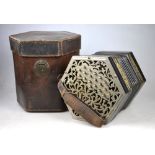 A 37-button concertina by C. Jeffries, with pierced nickel end-plates and ebonised woodwork, the
