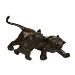 A 19th century Japanese bronze study of a bear attacking a tiger, signed to base, approximately 17