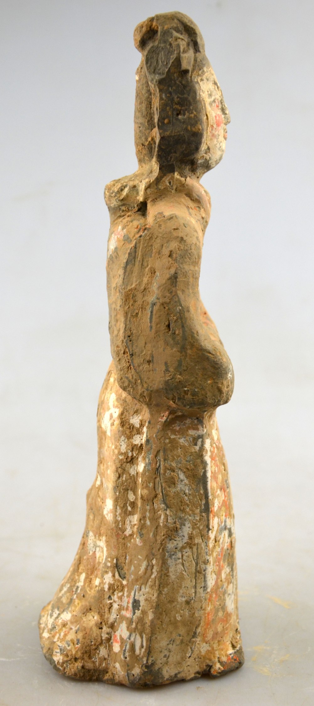 Chinese 5th century AD - a pottery funerary figure of a standing court lady, her arms folded, - Image 2 of 7