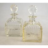 A pair of 19th century squat square decanters decorated with thumb nail cutting and having target