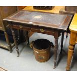 An Edwardian red walnut leather top writing table with two frieze drawers,