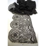 A box of 19th century and later black lace flounces, lengths on cards,