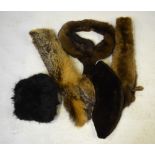 Two boxes containing a fur shoulder cape, three deep musquash fur stoles, a fox fur pieces,