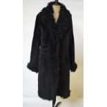 A Nicole Farhi black sheepskin coat with