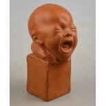 A terracotta head study of a crying baby