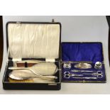 A cased manicure set with silver mounts,