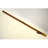 An 18th century malacca walking cane with white metal ferrule and ivory pommel,