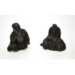 Two Chinese 'bronzed' figures, one seated on a mythical animal, approx. 6.5 cm h.