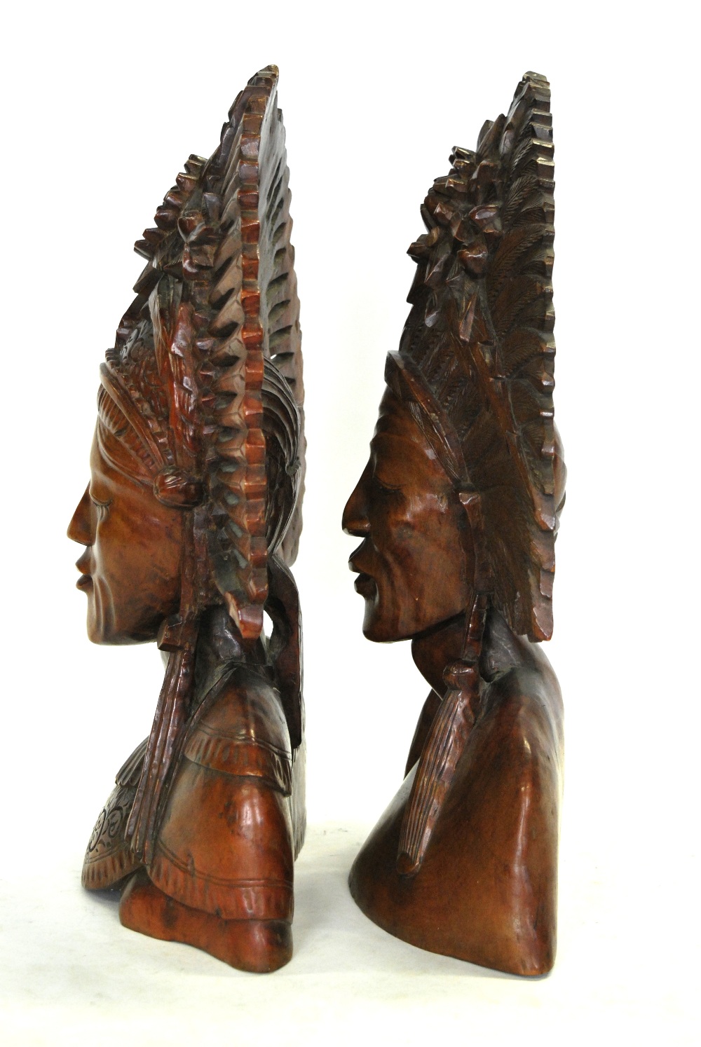 A pair of Balinese carved wood busts with ornate head-dresses, - Image 2 of 4