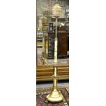A Victorian brass and ceramic telescopic standard lamp with gilt floral and foliate decoration