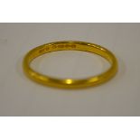 A 22ct yellow gold D-shaped wedding band, size R, approx 2.