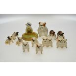 A collection of Beswick and Royal Doulton small bulldogs and puppies including a Beswick ashtray (