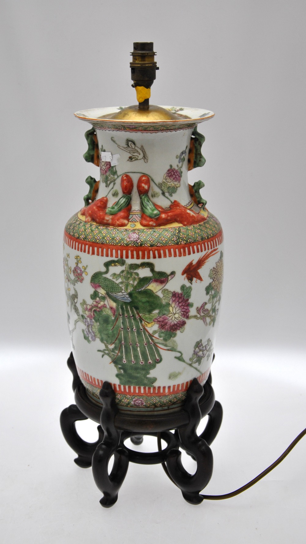 A Chinese famille rose baluster vase decorated with a variety of birds including peacocks, amidst - Image 3 of 4