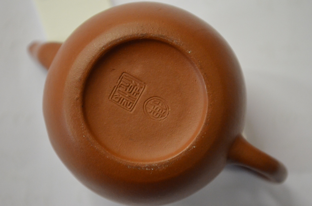 A Chinese miniature Yixing teapot, seal marks to the base, 6.5 cm h. Condition Report Chip to spout, - Image 5 of 5