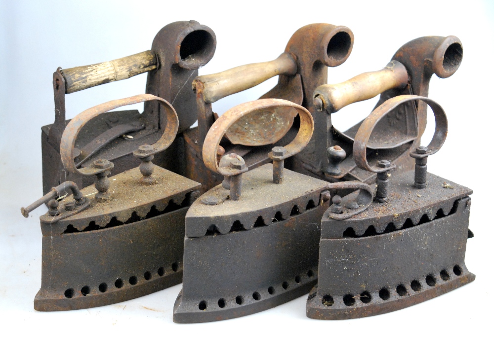 A collection of six antique flat-irons