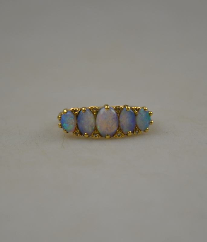 A black opal five stone ring with rose points between, 18ct yellow gold carved claw setting, - Image 2 of 2