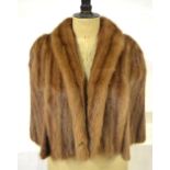 A shadowed light brown fur evening shoulder cape retailed by Maxwell Croft,