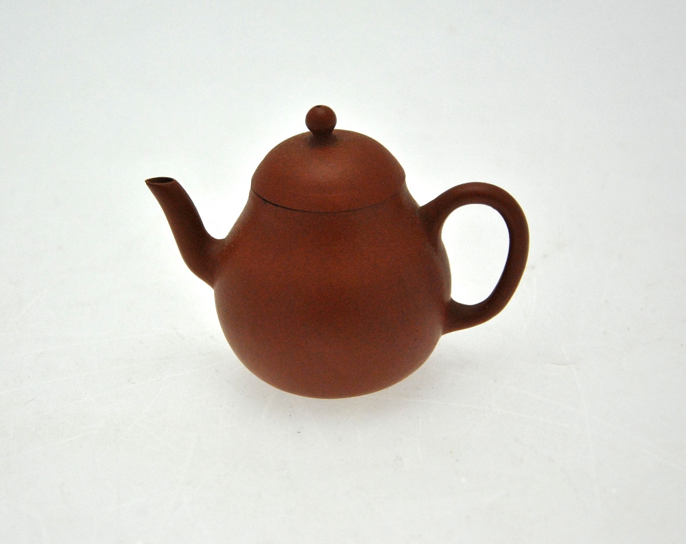 A Chinese miniature Yixing teapot, seal marks to the base, 6.5 cm h. Condition Report Chip to spout, - Image 2 of 5