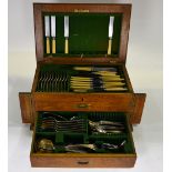 An oak canteen containing a mostly complete set of electroplated Old English Pattern flatware with